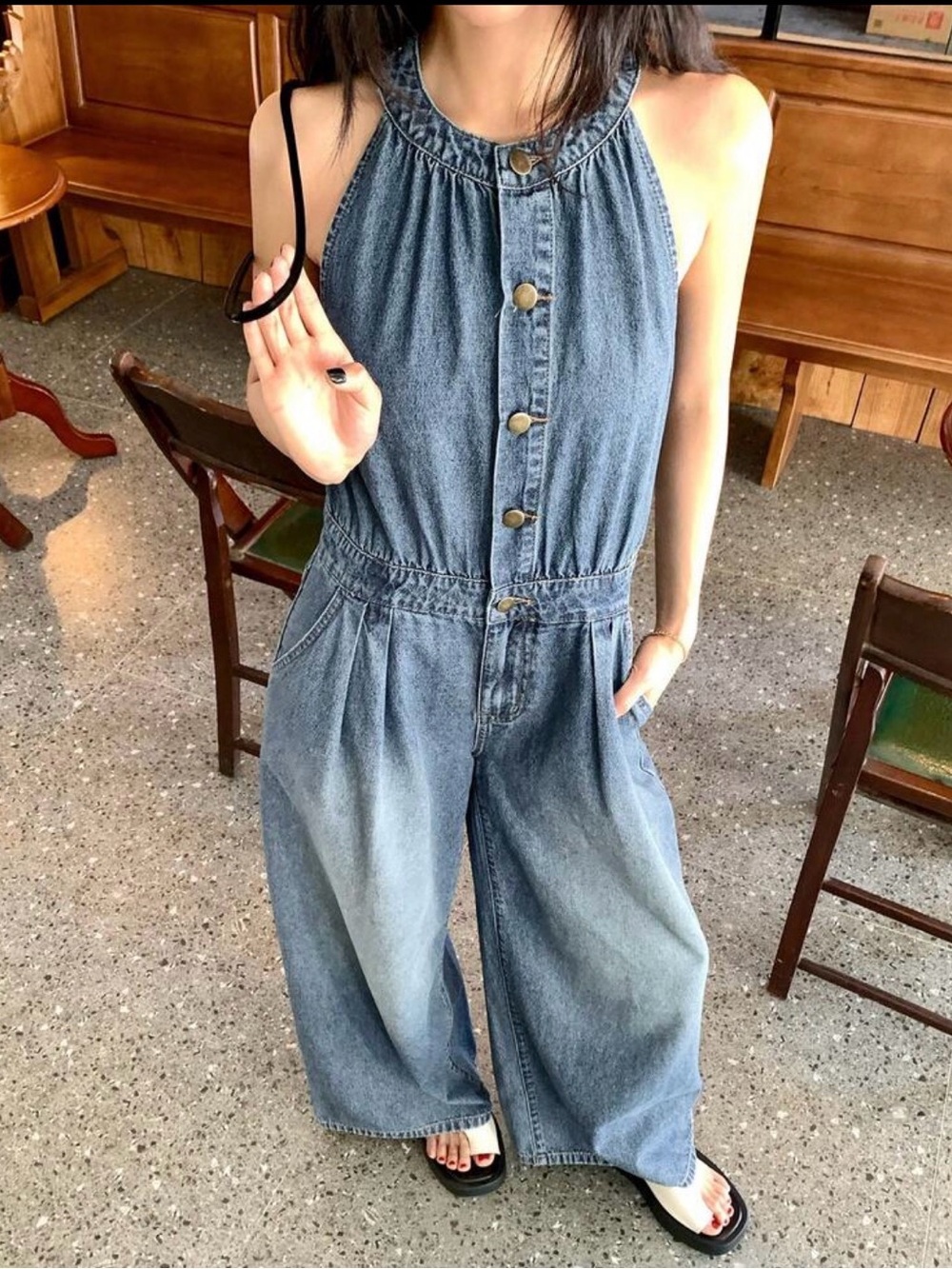 Blue denim jumpsuit with button-up front